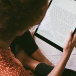 high angle photo of person reading an e book