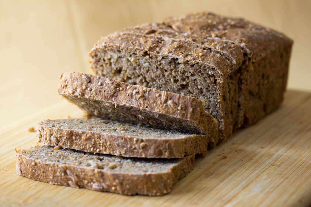 Wholegrain bread slices on a board