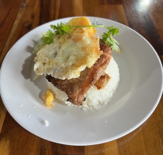 A bowl of cooked rice served at a restaurant