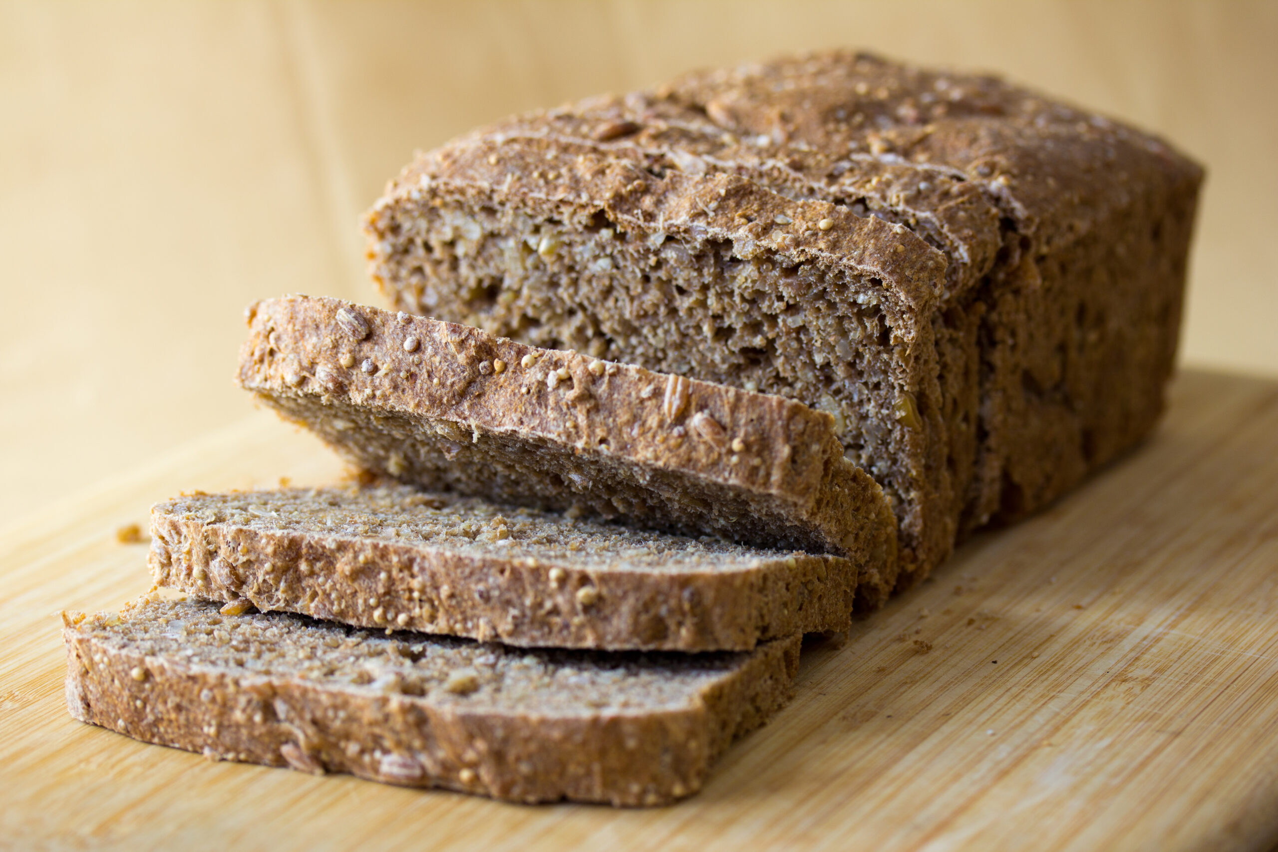 Wholegrain bread slices on a board