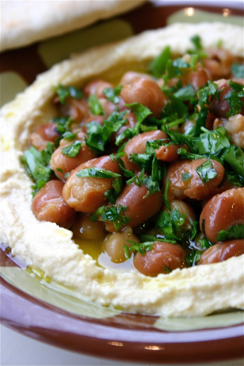 Hummus and ful served together on a plate